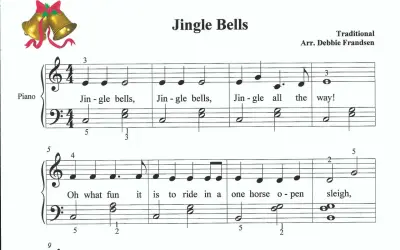 Nuty do piosenki "Jingle Bells" na keyboard. Złote dzwoneczki z czerwoną wstążką.
