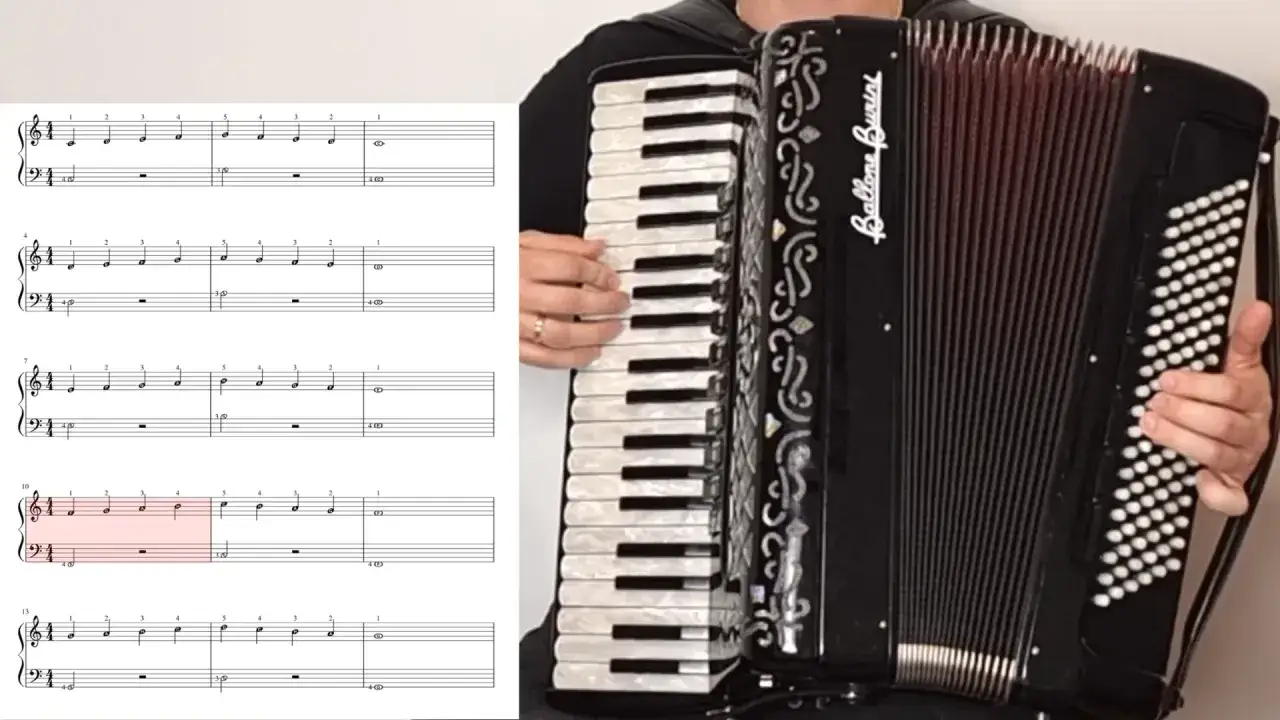 Nuty do nauki gry na akordeonie, z zaznaczonym fragmentem. Instrument z klawiaturą i miechem.