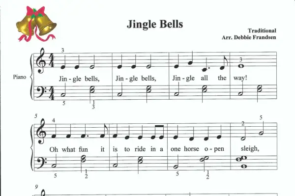 Nuty do piosenki "Jingle Bells" na keyboard. Złote dzwoneczki z czerwoną wstążką.